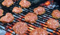 Grilled burgers on a barbecue grill close-up