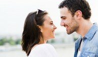 Young beautiful couple rubbing noses as a sign of love and about to kiss each other